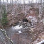 Wing-wall collapse at culvert downstream side  Also note South Shore Rail Grade erosion